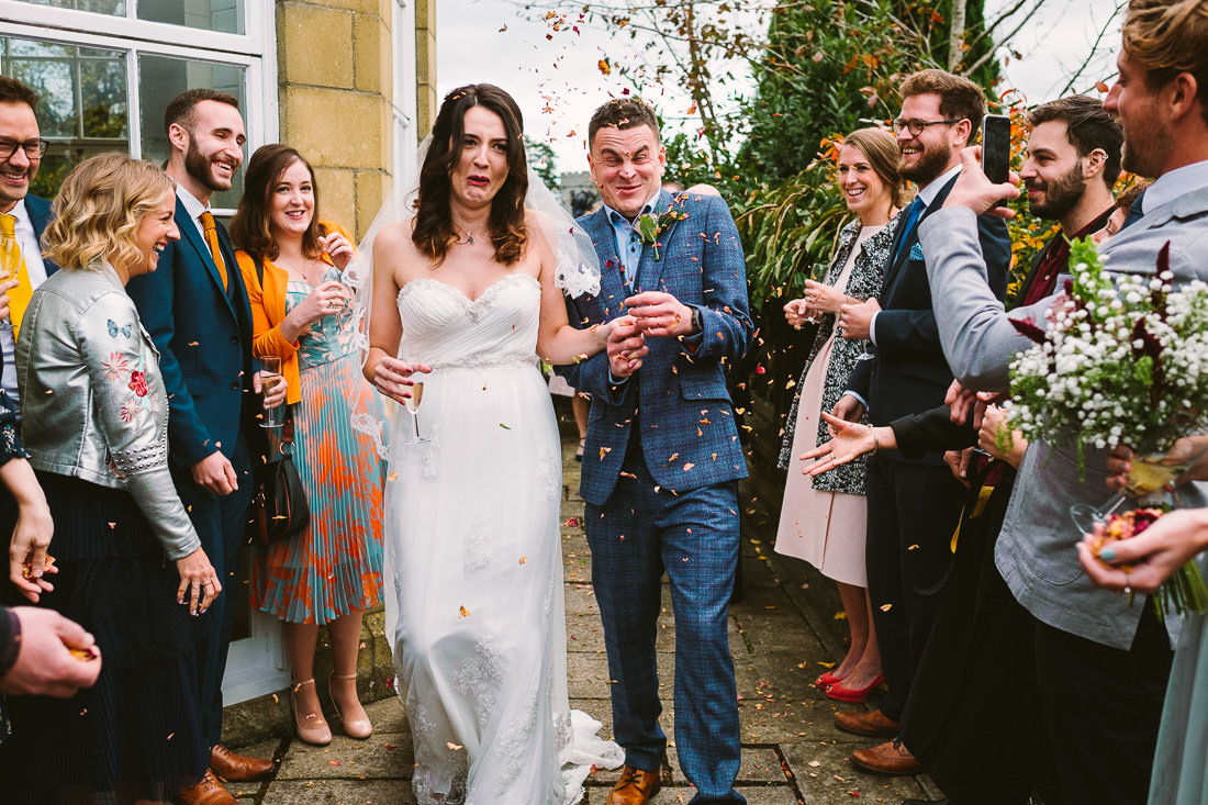 002 FUNNY CONFETTI SHOT AT PETERSTONE COURT WEDDING PHOTOGRAPHY BRECON BEACONS